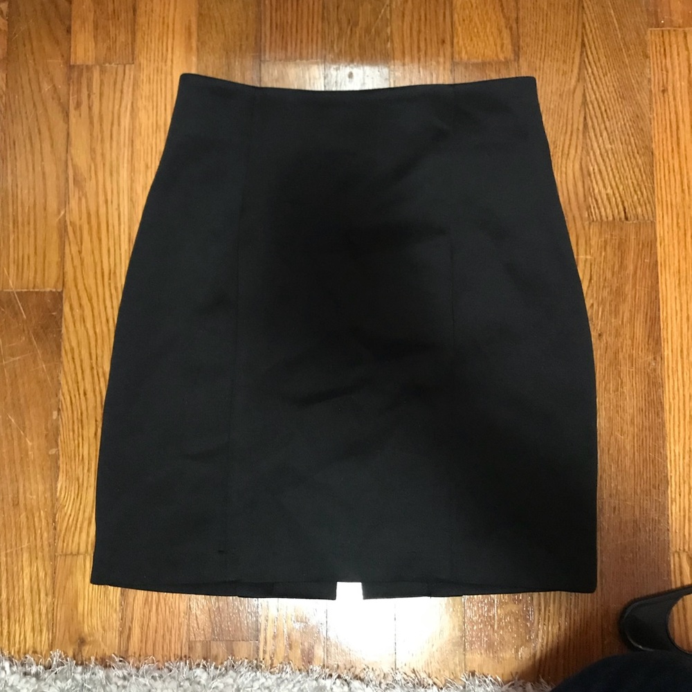 Black fitted mini skirt.